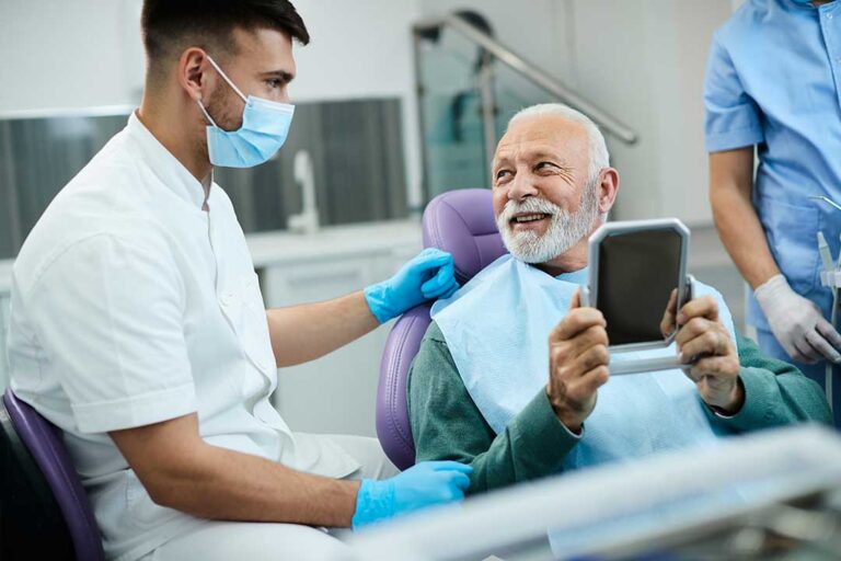 Adult and child reviewing dental appointment reminders beside toothbrushes and floss at home.